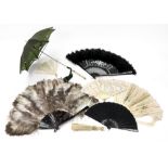 An ostrich feather fan, with tortoiseshell sticks, 70cm across, a black & silvered fan,