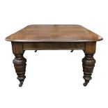 A late Victorian mahogany extending dining table,