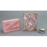 A set of twenty seven vintage dominoes, a Victorian mother of pearl diamond pattern note case,