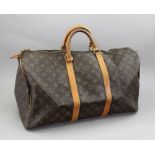 Louis Vuitton; a Keepall 50 monogram canvas bag, with gilt metal hardware, 50cm long.