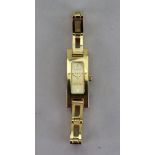 Gucci; a lady's 3900L gold plated quartz bracelet wristwatch,
