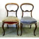 A set of six Victorian walnut balloon back chairs, circa 1860, with foliate scroll carved bars,