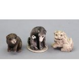 Three Japanese animal netsuke, comprising: a seated dog with puppy, 4.