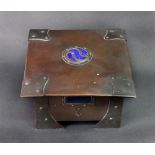 An Arts & Crafts copper box and cover, of square form with inset blue roundel to the cover,