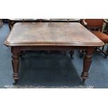 A Victorian mahogany extending dining table, circa 1860, the moulded rectangular top, now fixed,