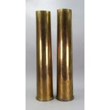 A pair of First World War brass shell cases, stamped SM1-00, 76/62, 51.5cm high.