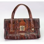 A vintage snakeskin handbag.
