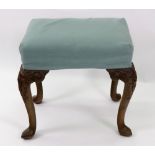 A reproduction George I style walnut frame dressing stool, with upholstered rectangular seat,