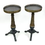 A pair of reproduction Regency style gilt and grey painted pedestal tables,