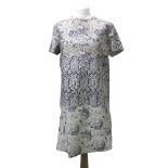 Acne Studios; a lady's leather dress/tunic, with printed patterns of birds, vines and flowers,