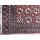 An Indian carpet of stylised Turkman design.