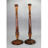 A pair of George III style faux mahogany and satinwood candlesticks, circa 1900,