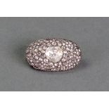A diamond cluster brooch, the oval brooch set centrally with a rose cut diamond,