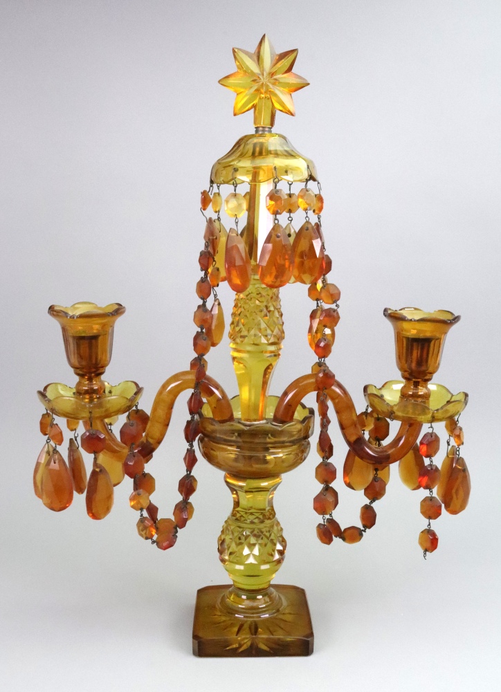 An amber glass candelabrum, late 19th/early 20th century,