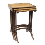 A nest of three Regency satinwood and coromandelwood tables,