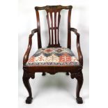 A mid 18th century mahogany open arm elbow chair,