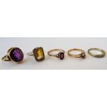 A 9ct gold ring, collet set with an oval cut amethyst, a citrine and marcasite set ring,