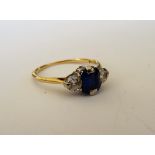 A gold, sapphire and diamond three stone ring,