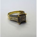 A gold and diamond square cluster ring,