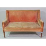 An Edwardian mahogany framed two seat sofa on block supports, 134cm wide.