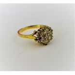 An 18ct gold and diamond cluster ring,