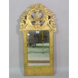 A 19th century Continental gilt framed wall mirror with floral crest, 39cm wide x 79cm high.
