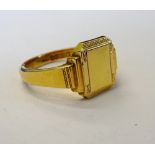 A gentleman's 18ct gold signet ring, of cut cornered rectangular form, partially engine turned,