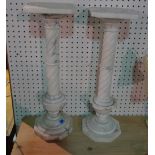 A pair of 20th century white marble columns on octagonal plinth bases, 60cm high (2).