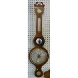 A late 19th century mahogany wheel barometer,