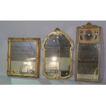 A large gilt framed mirror, 57cm wide x 90cm high and two further smaller, (3).