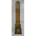 A Welsh pine grit holder/ knife sharpener, probably 18th century, 77cm high.