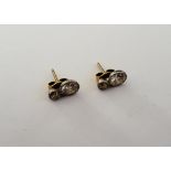 A pair of diamond set two stone earstuds,