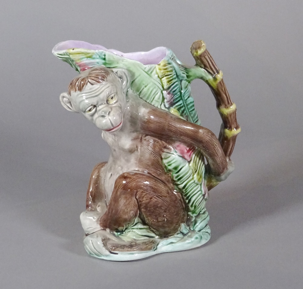 A majolica 'monkey' jug, late 19th/ early 20th century, the monkey modelled seated,