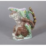 A majolica 'monkey' jug, late 19th/ early 20th century, the monkey modelled seated,