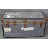 An early 20th century metal bound lift top trunk, 100cm wide x 51cm high.