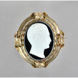 A Victorian black and white paste imitating banded agate cameo brooch,