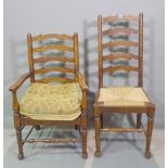 A set of six early 20th century oak ladder back dining chairs with rush seats,