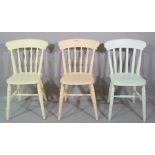 A matched set of six 20th century painted pine stick back dining chairs, each in a different colour,