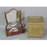 A George III mahogany bowfront three drawer dressing table mirror with shield shaped mirror back on