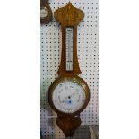 A Victorian mahogany 8" wheel barometer, with foliate inlay, applied thermometer and enamel dial,
