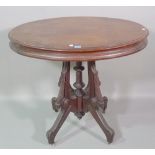 A 20th century mahogany oval centre table on carved downswept supports, 85cm wide x 76cm high, (a.f.