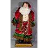 A contemporary life size figure of Father Christmas, dressed in traditional clothes on plinth base,