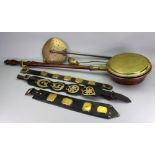 A brass and copper warming pan, late 18th/early 19th century, with turned mahogany handle,