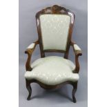 A Louis XV style carved walnut frame fauteuil, late 19th century.