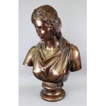 A reproduction bronzed classical female bust, 71cm high.