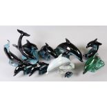 A collection of eight Poole Pottery figures of dolphins and two groups of two dolphins,