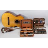 A Resonata German acoustic guitar, a shooting stick, various other sticks, wooden embroidery stand,