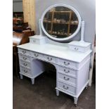 An Edwardian pine dressing table, later pale blue painted, 130cm wide x 56cm deep x 154cm high,