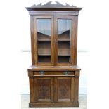 An Edwardian walnut bookcase cabinet, 108cm wide x 34cm deep x 210cm high.