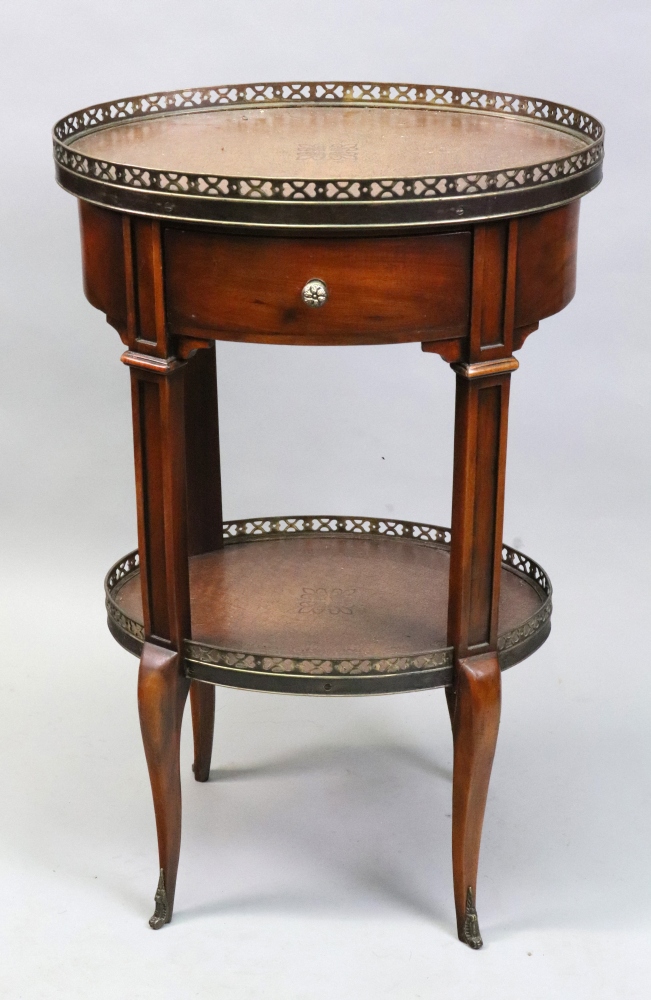 A reproduction Louis XVI style oval two-tier etagere by Theodore Alexander,